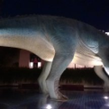 Alasar,the main character of 2000's Dinosaur movie, replaced the original statue, an Styracosaurus.
